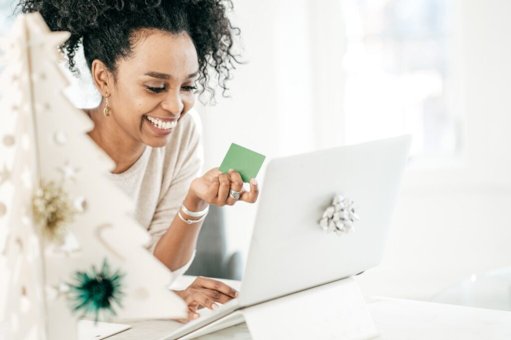 A woman using one of her gift cards to shop online